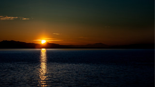 Sunset mountains water orange sky 2 - alan sutherland free wallpaper