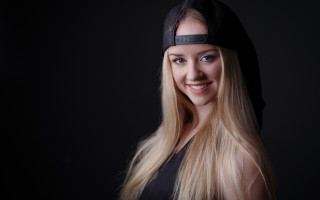 Woman blonde hat smile blueeyes - a black background behind her free wallpaper