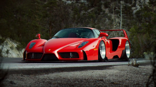 Red sports car forest road 2 - a forest of trees and bushes free wallpaper