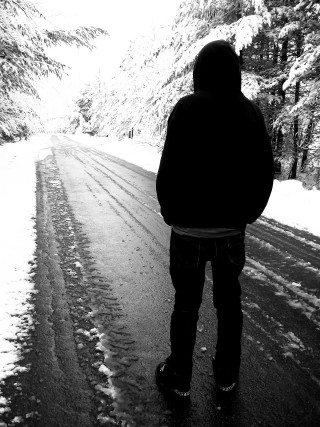 Snowy road woods person standing - winter free wallpaper for mobile