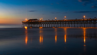 Pier night lights reflection building - a pier free wallpaper for desktop