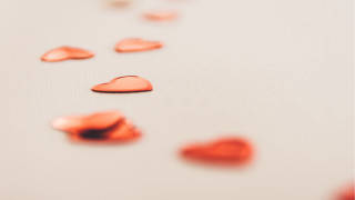 Romantic hearts table cellphone red - a person holding free wallpaper