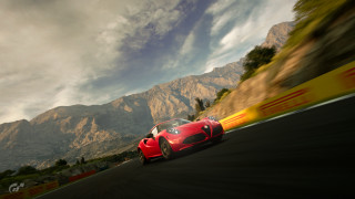 Red sports car mountains clouds 9 - f 8 aperture free wallpaper
