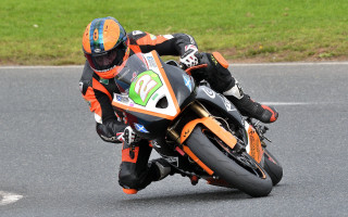 Motorcycle rider race track helmet 2 - the background and grass free wallpaper