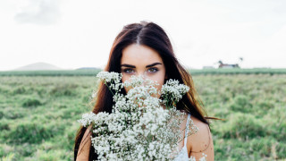Woman flower field portrait blurry - a bunch of flowers free wallpaper