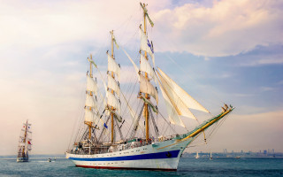 Sailboat ocean cloudy sky water - a large white sail free wallpaper