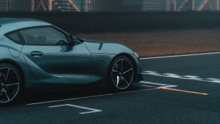 Blue sports car road building - side profile free wallpaper