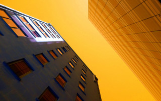 Tall building windows yellow sky - each side of it free wallpaper