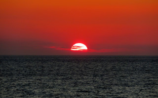 Sunset ocean red sky boat - free sunset wallpaper