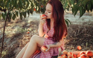 Red hair woman eating fruit - a basket free wallpaper for desktop