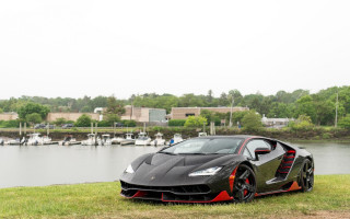 Black red sportscar lake boats - the water behind free wallpaper