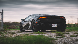 Black sports car field cloudy - the front of the car free wallpaper