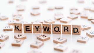 Wooden blocks spelling keyword white - a word free wallpaper