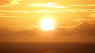 Sunset sky clouds boat ocean - a sunset free wallpaper for desktop