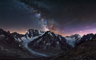Snowy mountain range star filled - sky above free wallpaper