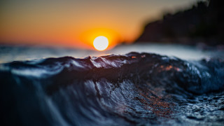Dark blue ocean sunset waves - the background and the water free wallpaper