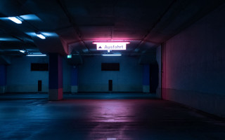 Dark parking garage neon sign - the wall above free wallpaper for desktop