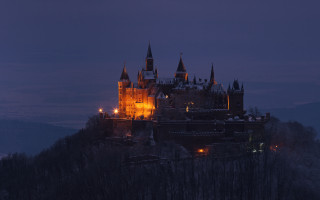Castle night hill trees cityscape - a dark sky in the background free wallpaper for desktop