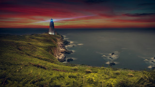 Lighthouse cliff ocean night red - a lighthouse free wallpaper