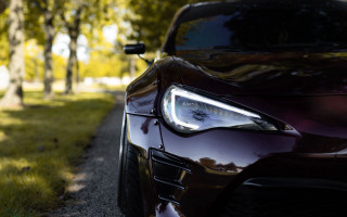 Car closeup road treeline grass - a close up of a car free wallpaper