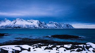 Snowy mountain range water shore - a snowy mountain range free wallpaper