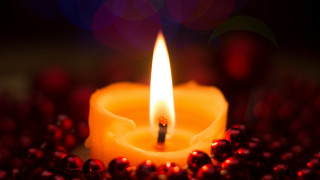Lit candle red berries bokeh - a boke of lights free wallpaper