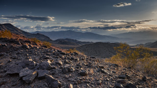 Rocky hillside mountains sunset clouds - a rocky hillside free wallpaper