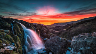 Waterfall sunset red sky rocks - a red sky in the background free wallpaper