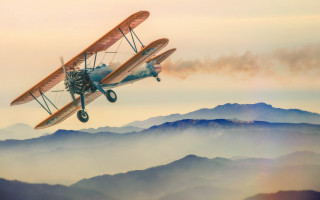 Small airplane dieselpunk mountains orange - the wing free wallpaper