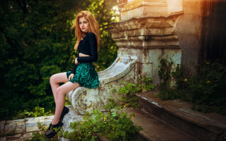 Woman sitting green skirt gothic - a stone wall free wallpaper