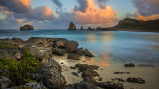 Rocky beach cross sunset clouds - a rocky beach free wallpaper