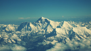 Mountain range airplane window clouds - free mountains wallpaper
