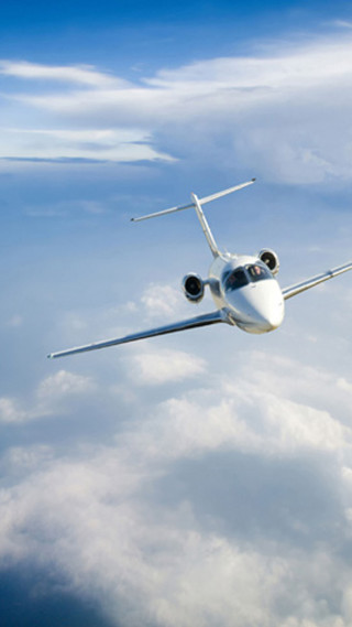 Jetliner flying blue cloudy sky - free airplane wallpaper for mobile