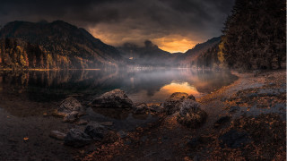 Lake mountains cloudy sky lighthouse - a light house in the distance free wallpaper