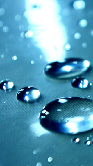 Water droplets closeup blue background - water free wallpaper for mobile