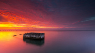 Sunset water mountain shore clouds - moody free wallpaper