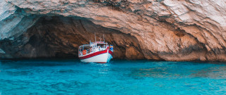 Ocean boat cave rock saturated - exekia free wallpaper