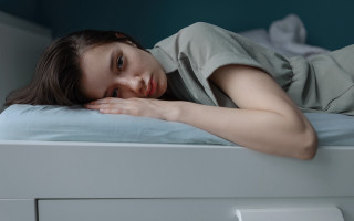 Woman laying on bed blurry 2 - her chest free wallpaper