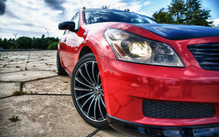 Red car parking lot clouds 3 - a red car free wallpaper