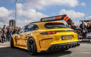 Yellow sportscar streetSign crowd panfuturism - side profile free wallpaper