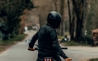 Motorcycle rider forest road blurry - tree and grass free wallpaper