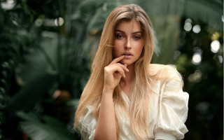 Blonde woman tropical portrait bokeh - a tropical setting free wallpaper