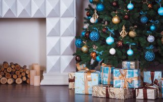 Christmas tree presents fireplace mantel 2 - a fireplace in the background free wallpaper