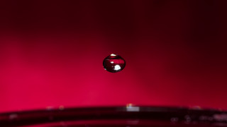 Water drop red background macro - artistic free wallpaper