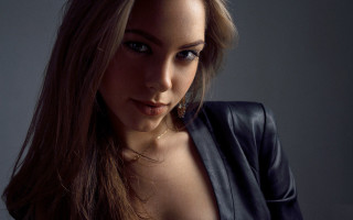 Serious woman long hair black - a black jacket free wallpaper for desktop