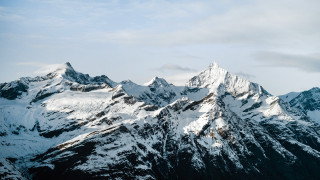 Mountain range snow capped horizon - cloud above free wallpaper
