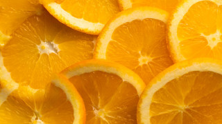 Orange slices closeup white background - a table top free wallpaper