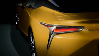 Yellow sports car closeup dark - a black floor free wallpaper