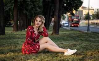 Woman sitting grass red dress - white sneaker free wallpaper