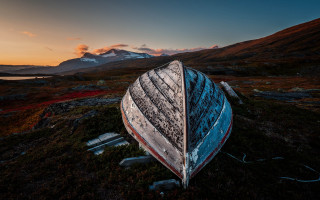 Boat grass mountain sunset sky - top of a grass free wallpaper
